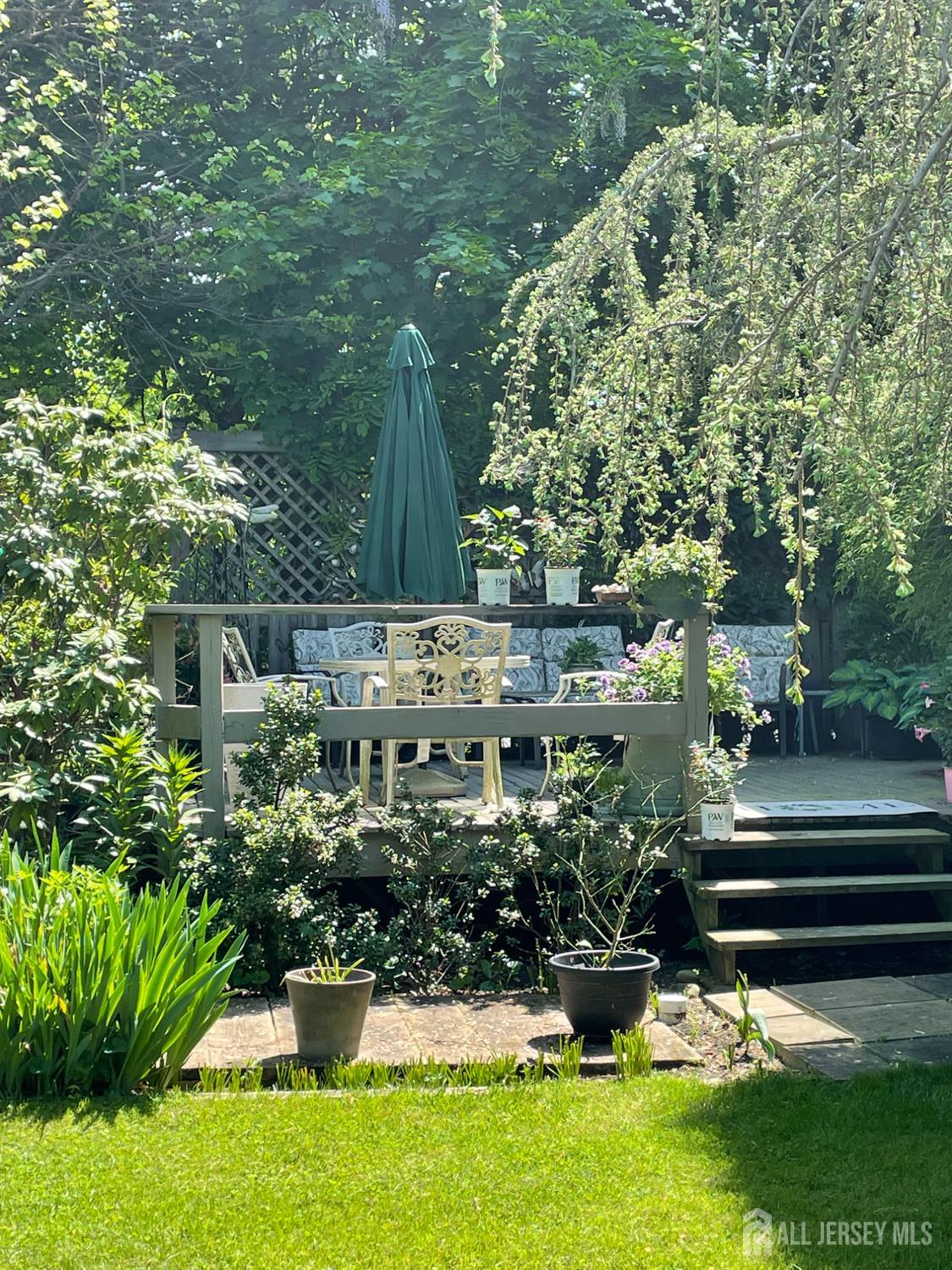 181 Disbrow Hill Road Monroe Township, NJ 08831 - Photo 20 of 21 a view of a garden with sitting area