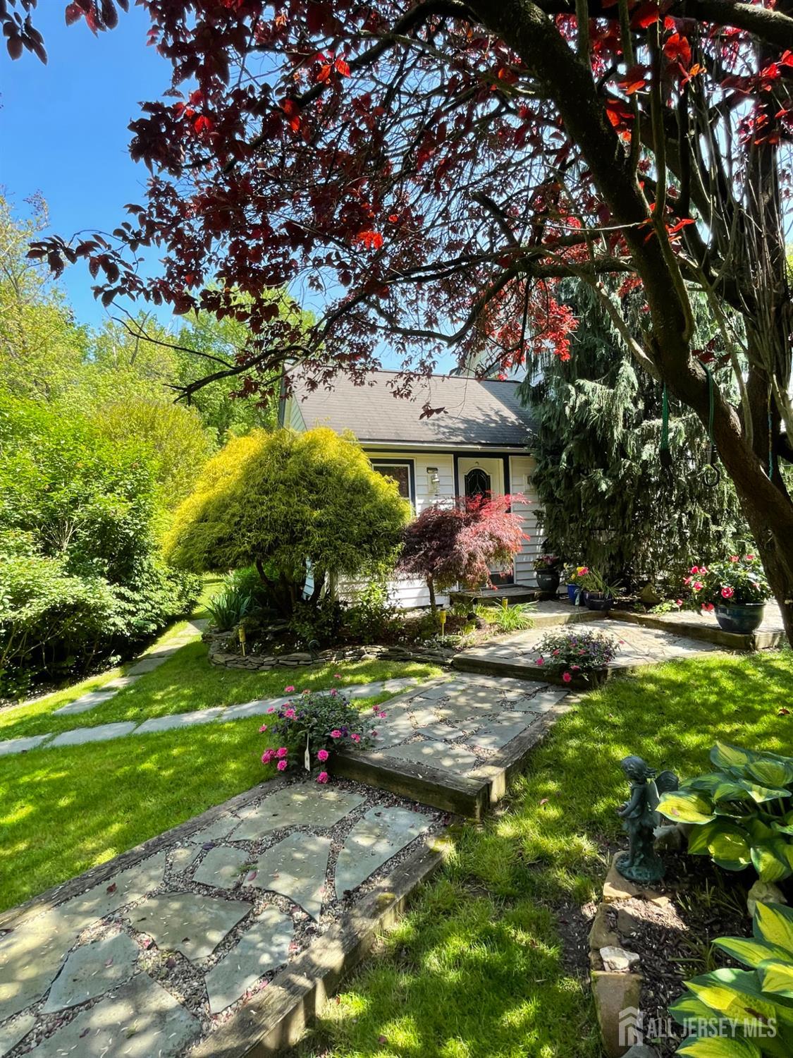 181 Disbrow Hill Road Monroe Township, NJ 08831 - Photo 2 of 21 a view of swimming pool is middle in the garden