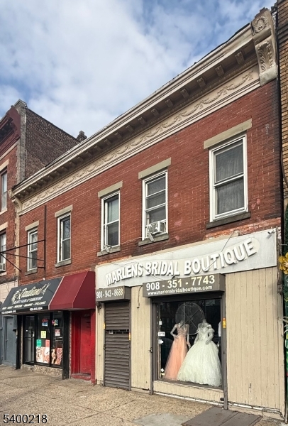 1133 Elizabeth Avenue Elizabeth, NJ 07201 - Photo 1 of 12 a front view of a building with a lot of windows and entertaining space