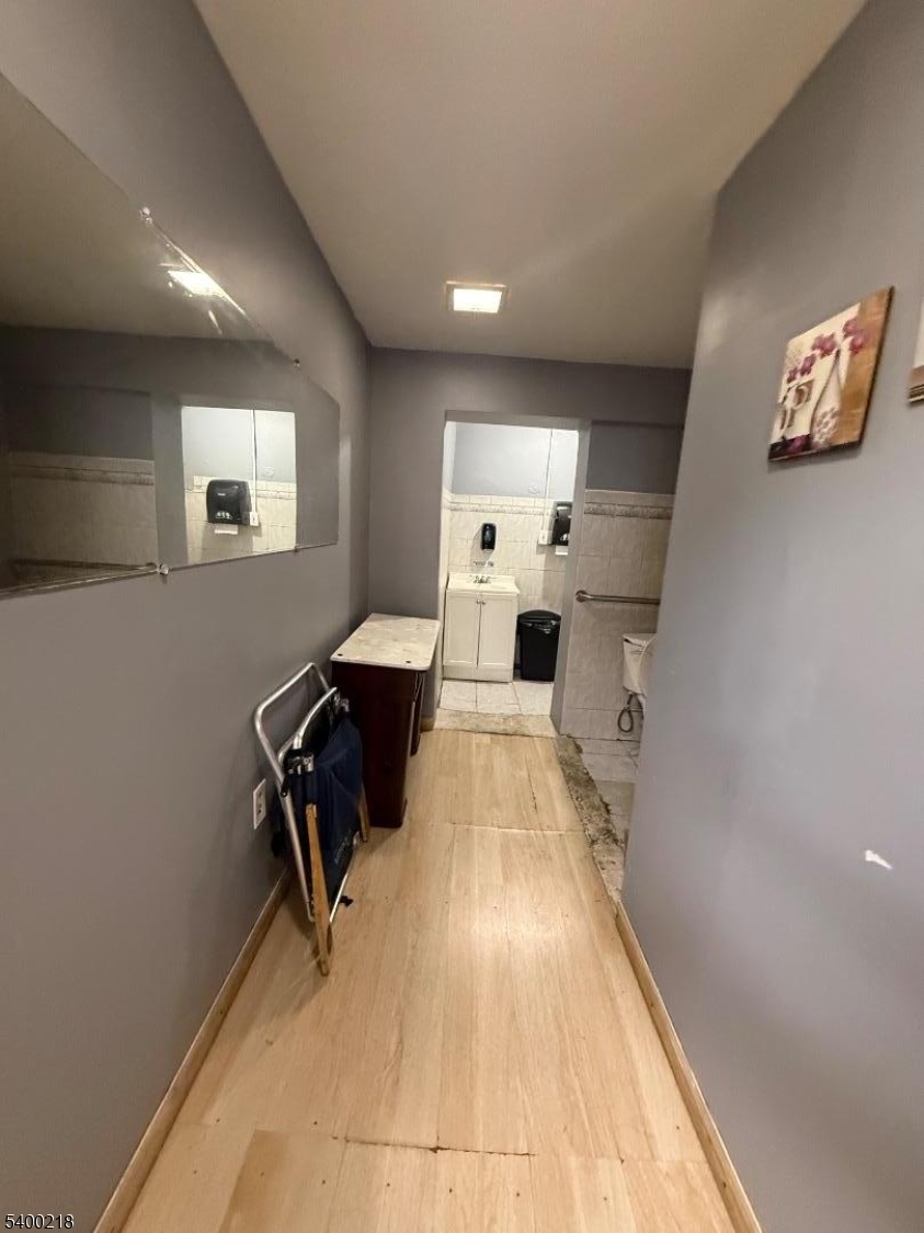 1133 Elizabeth Avenue Elizabeth, NJ 07201 - Photo 12 of 12 a bed room with a bed