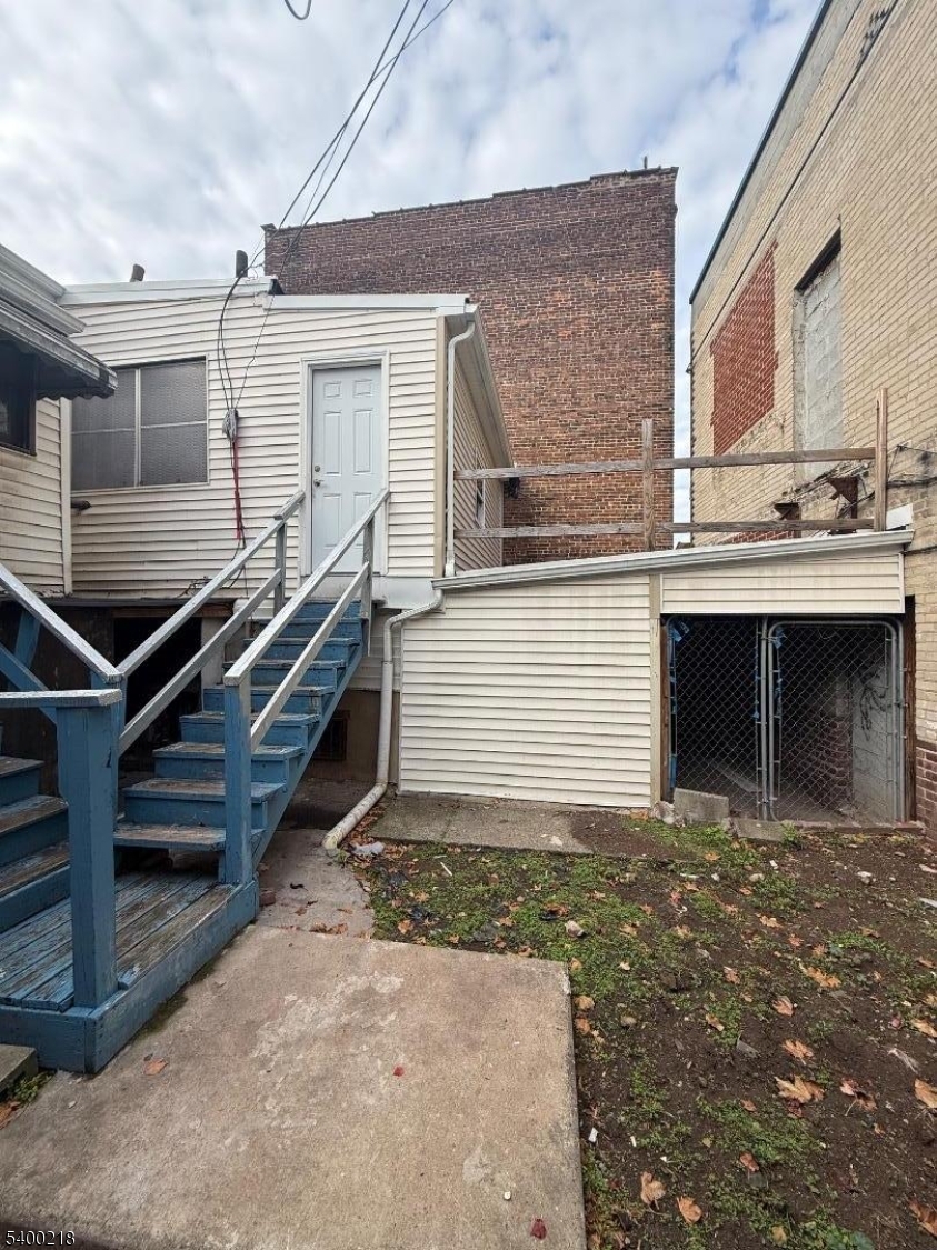 1133 Elizabeth Avenue Elizabeth, NJ 07201 - Photo 2 of 12 a front view of a house with garage