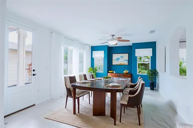 a view of a dining room with furniture and window