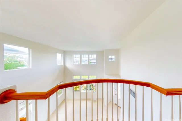 a view of staircase with rug