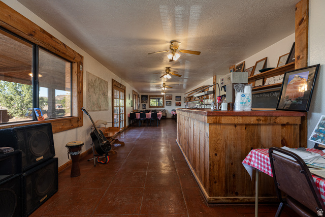 2040 North Long Cyn Road Kanab, UT 84741 - Photo 5 of 23 Kitchen featuring a ceiling fan and a textured ceiling