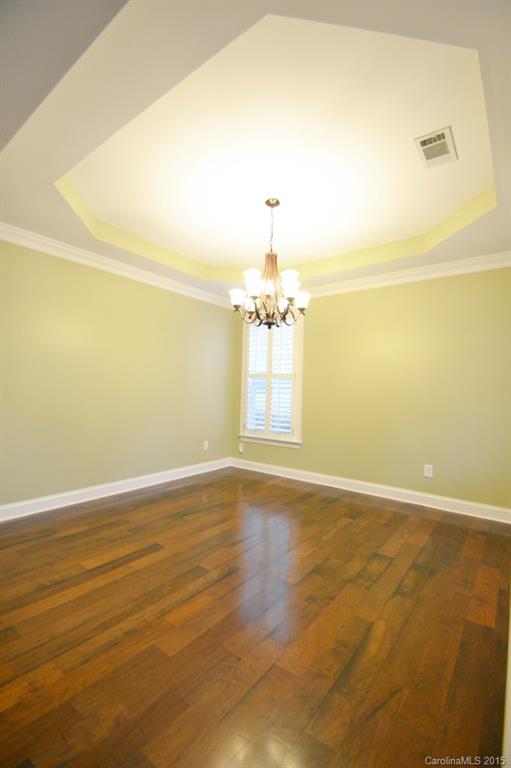 9433 Ridgeforest Drive Charlotte, NC 28277 - Photo 5 of 18 a view of an empty room with wooden floor