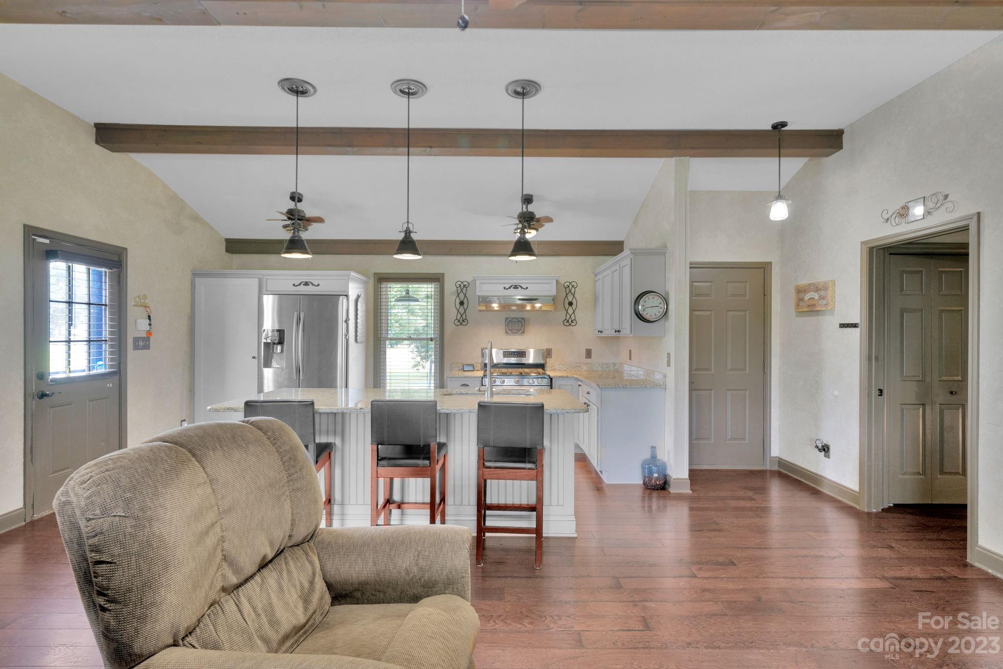3016 Old Montgomery Place Road Monroe, NC 28112 - Photo 16 of 40 a living room with furniture and a chandelier
