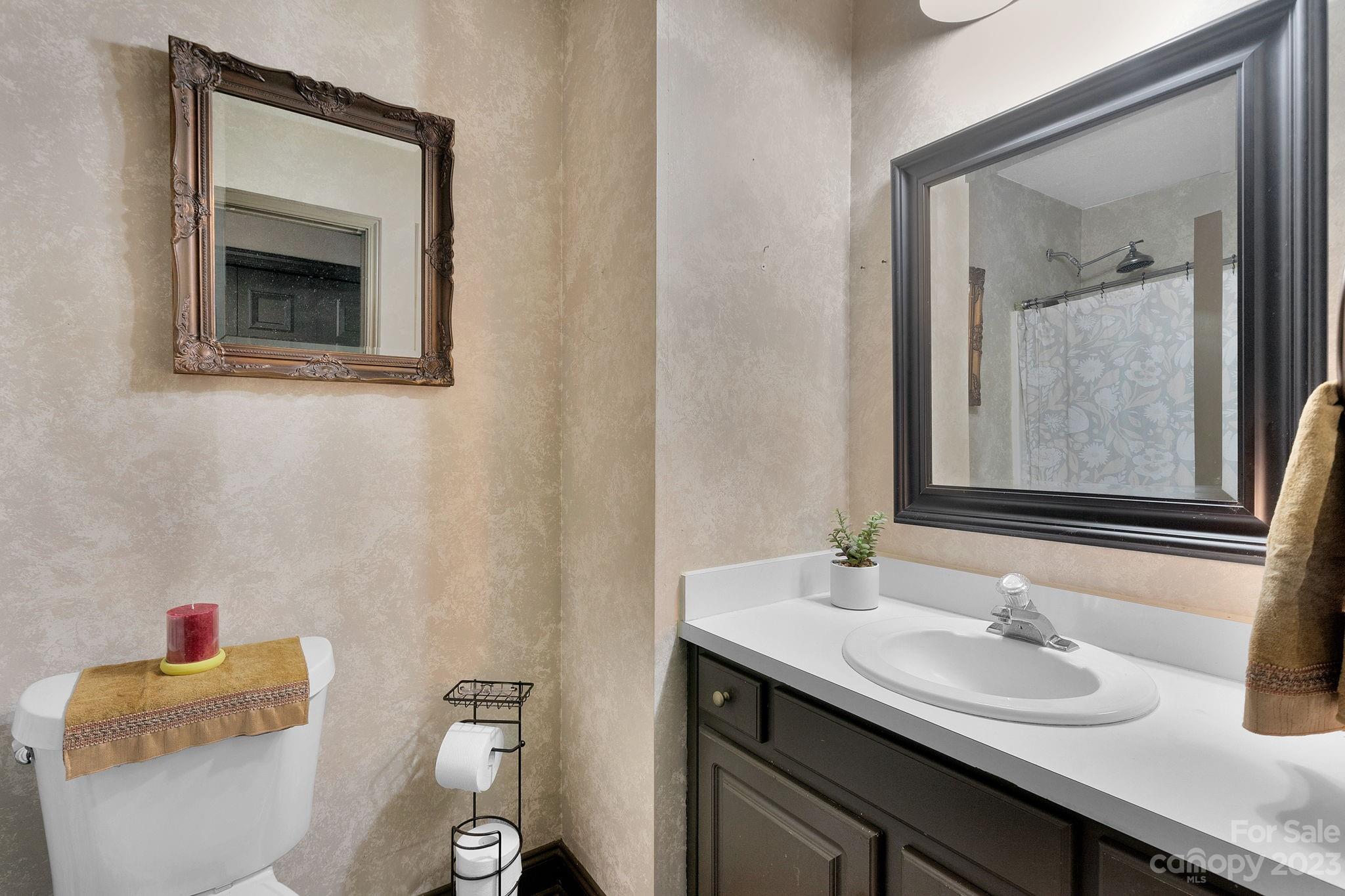 3016 Old Montgomery Place Road Monroe, NC 28112 - Photo 18 of 40 a bathroom with a toilet sink and mirror