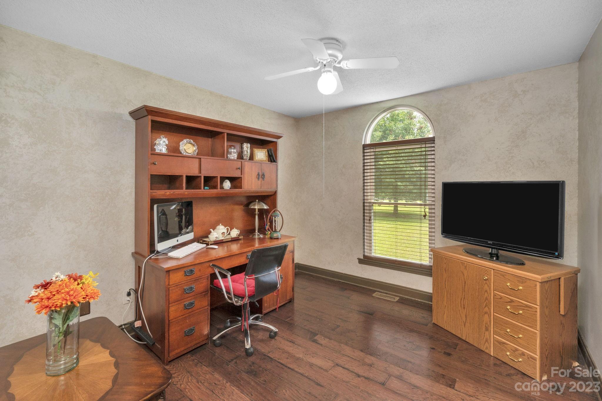 3016 Old Montgomery Place Road Monroe, NC 28112 - Photo 19 of 40 a living room with furniture and a flat screen tv