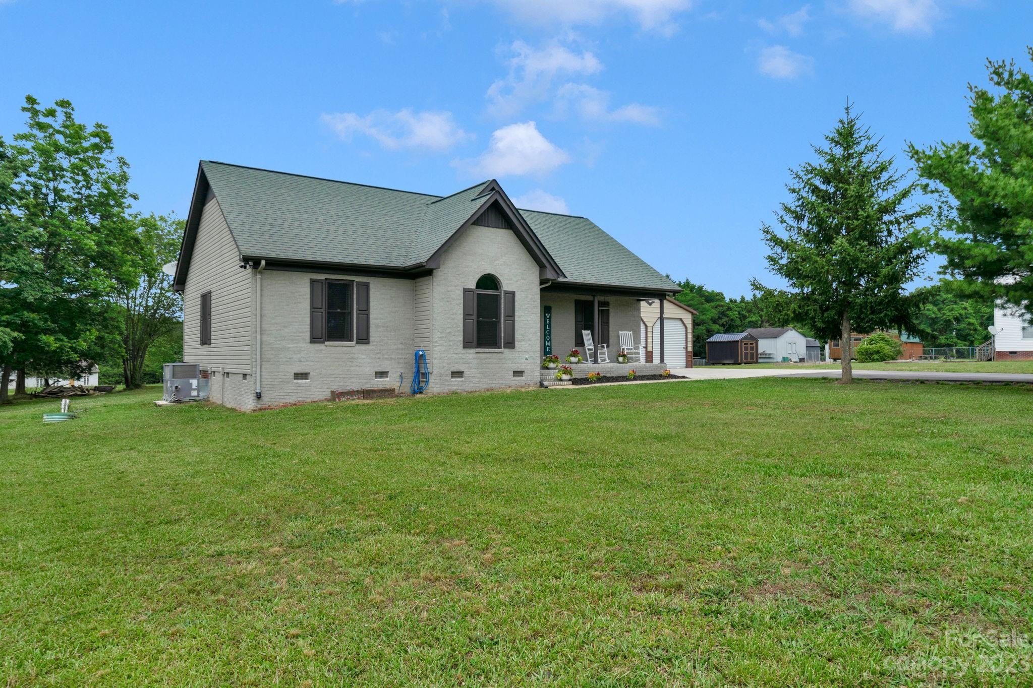 3016 Old Montgomery Place Road Monroe, NC 28112 - Photo 2 of 40 a front view of house with yard and green space