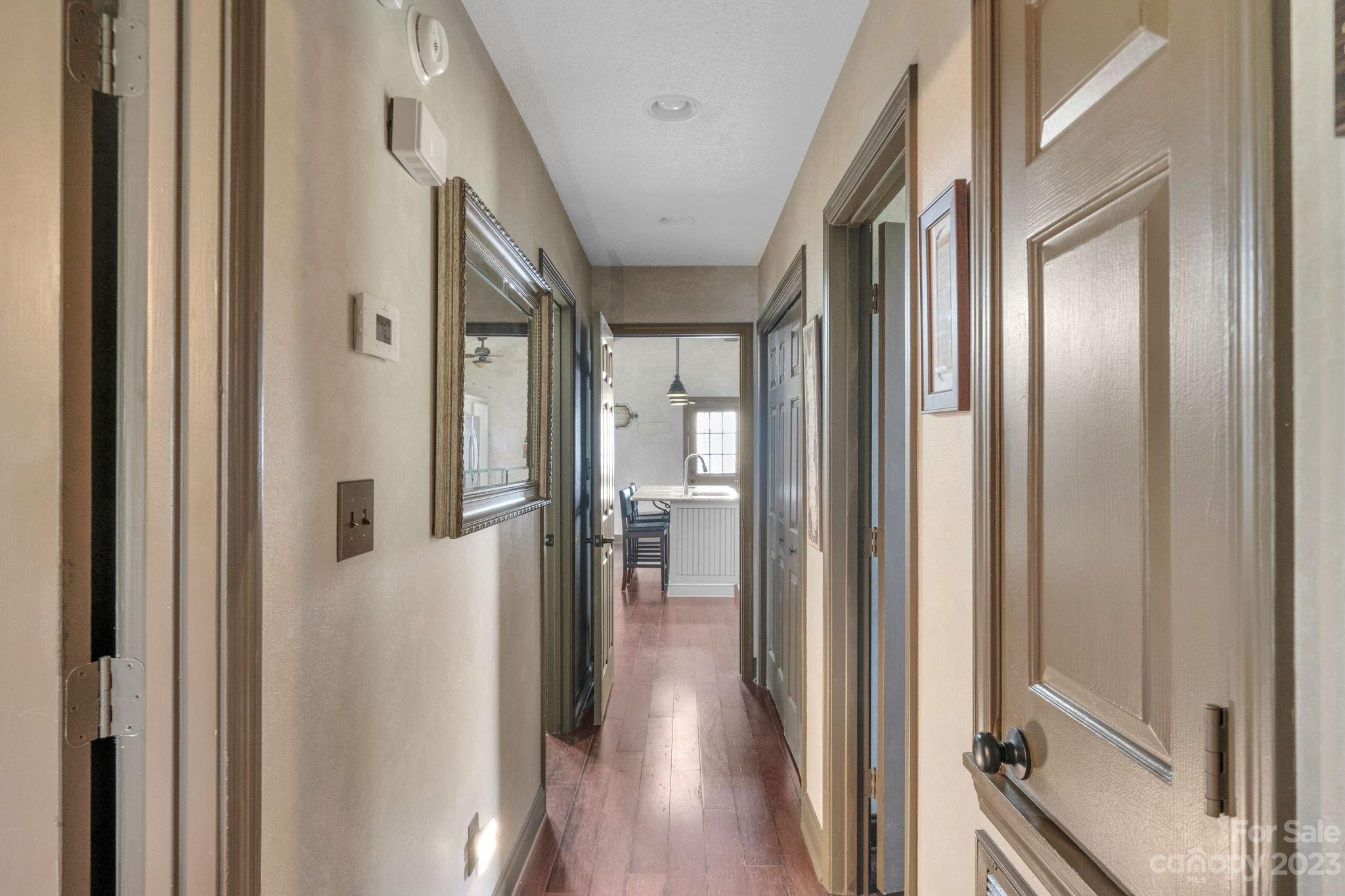 3016 Old Montgomery Place Road Monroe, NC 28112 - Photo 25 of 40 a view of a hallway with wooden floor and staircase