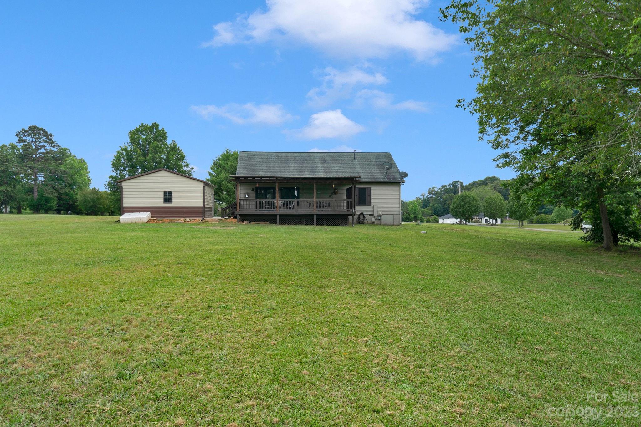 3016 Old Montgomery Place Road Monroe, NC 28112 - Photo 34 of 40 a aerial view of a house with a yard