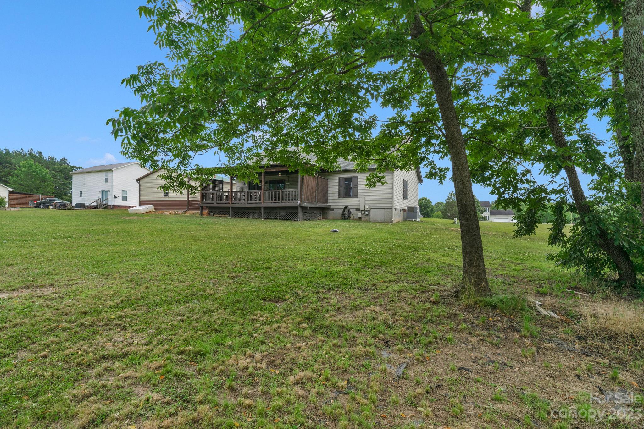 3016 Old Montgomery Place Road Monroe, NC 28112 - Photo 35 of 40 a backyard of a house with lots of green space