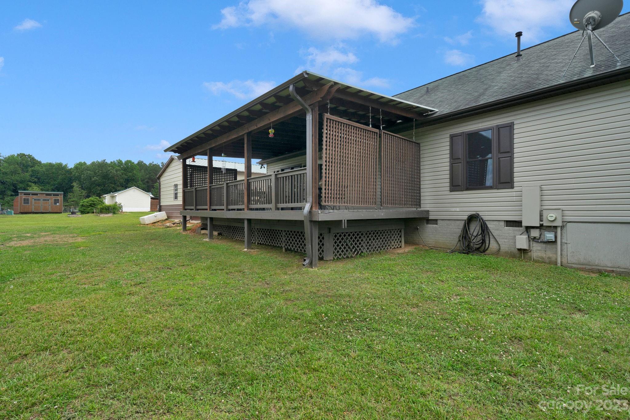 3016 Old Montgomery Place Road Monroe, NC 28112 - Photo 37 of 40 a view of a house with a backyard
