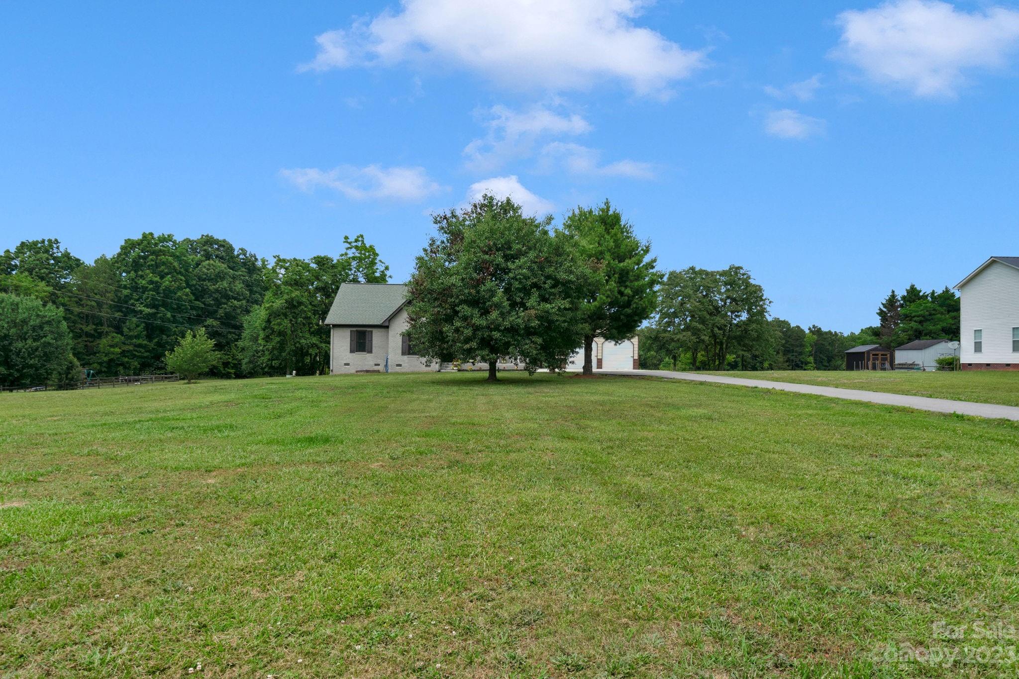 3016 Old Montgomery Place Road Monroe, NC 28112 - Photo 39 of 40 a view of a house with a yard