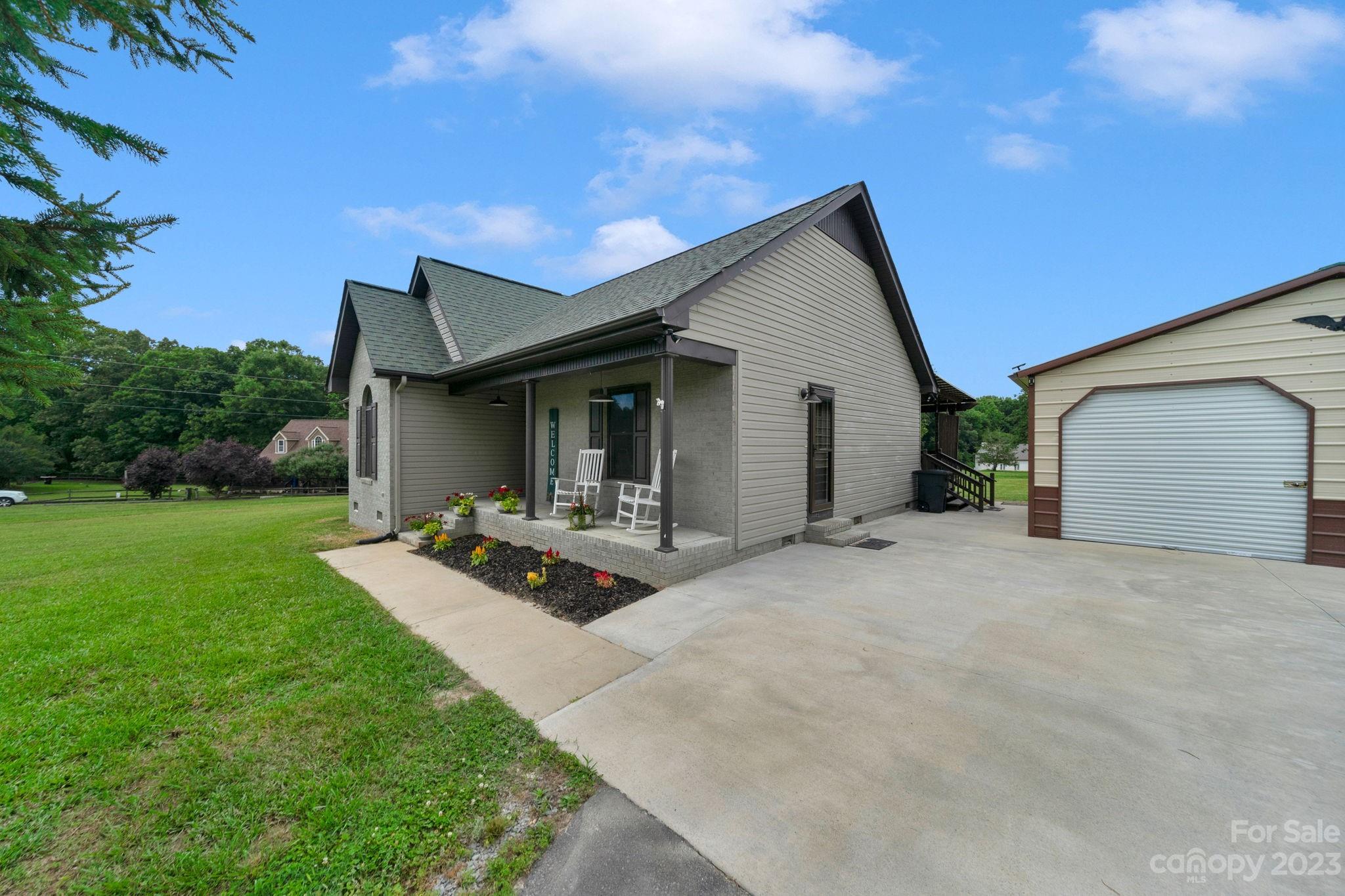 3016 Old Montgomery Place Road Monroe, NC 28112 - Photo 4 of 40 a front view of house with backyard and green space
