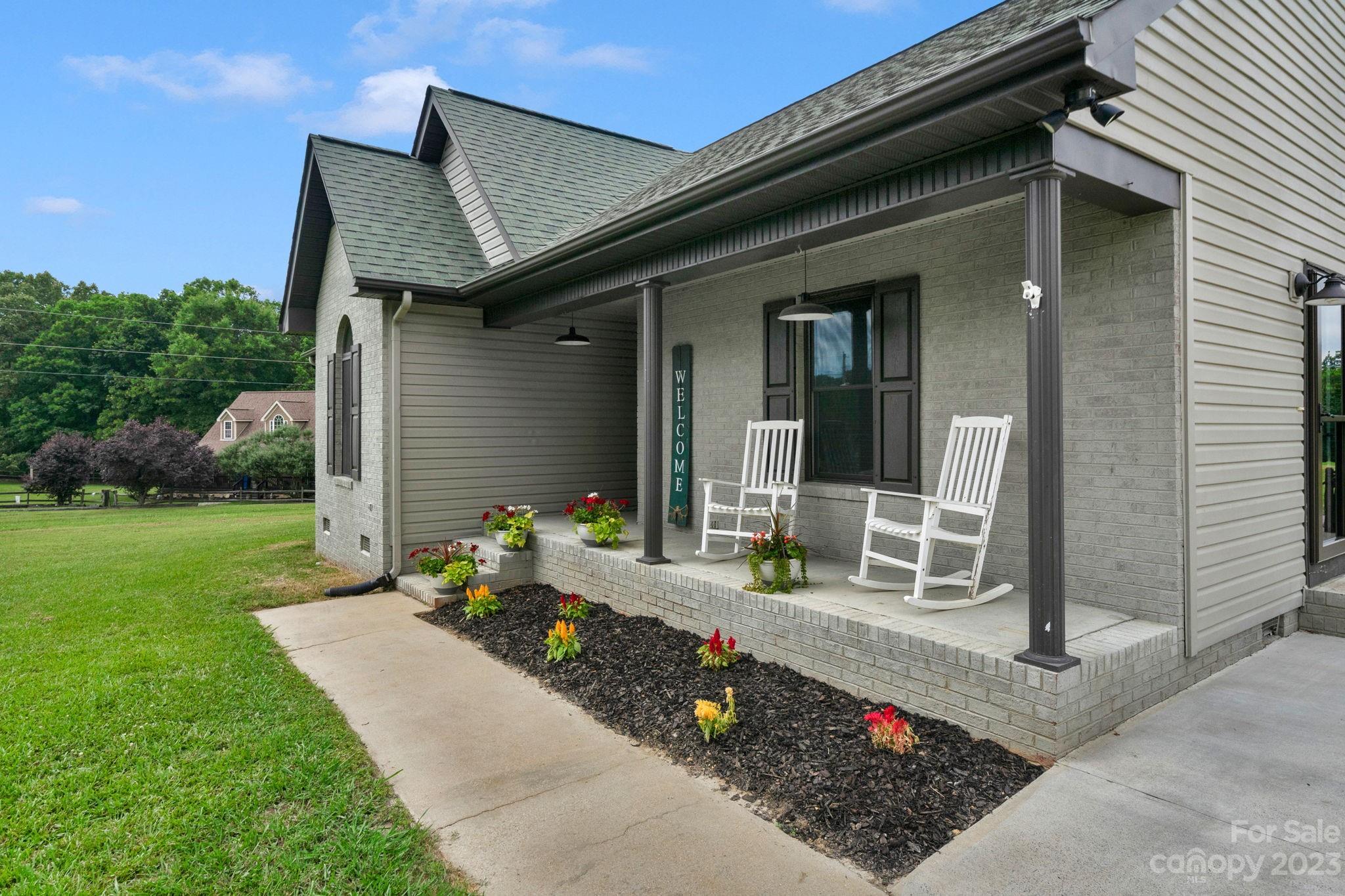 3016 Old Montgomery Place Road Monroe, NC 28112 - Photo 5 of 40 a front view of a house with a garden
