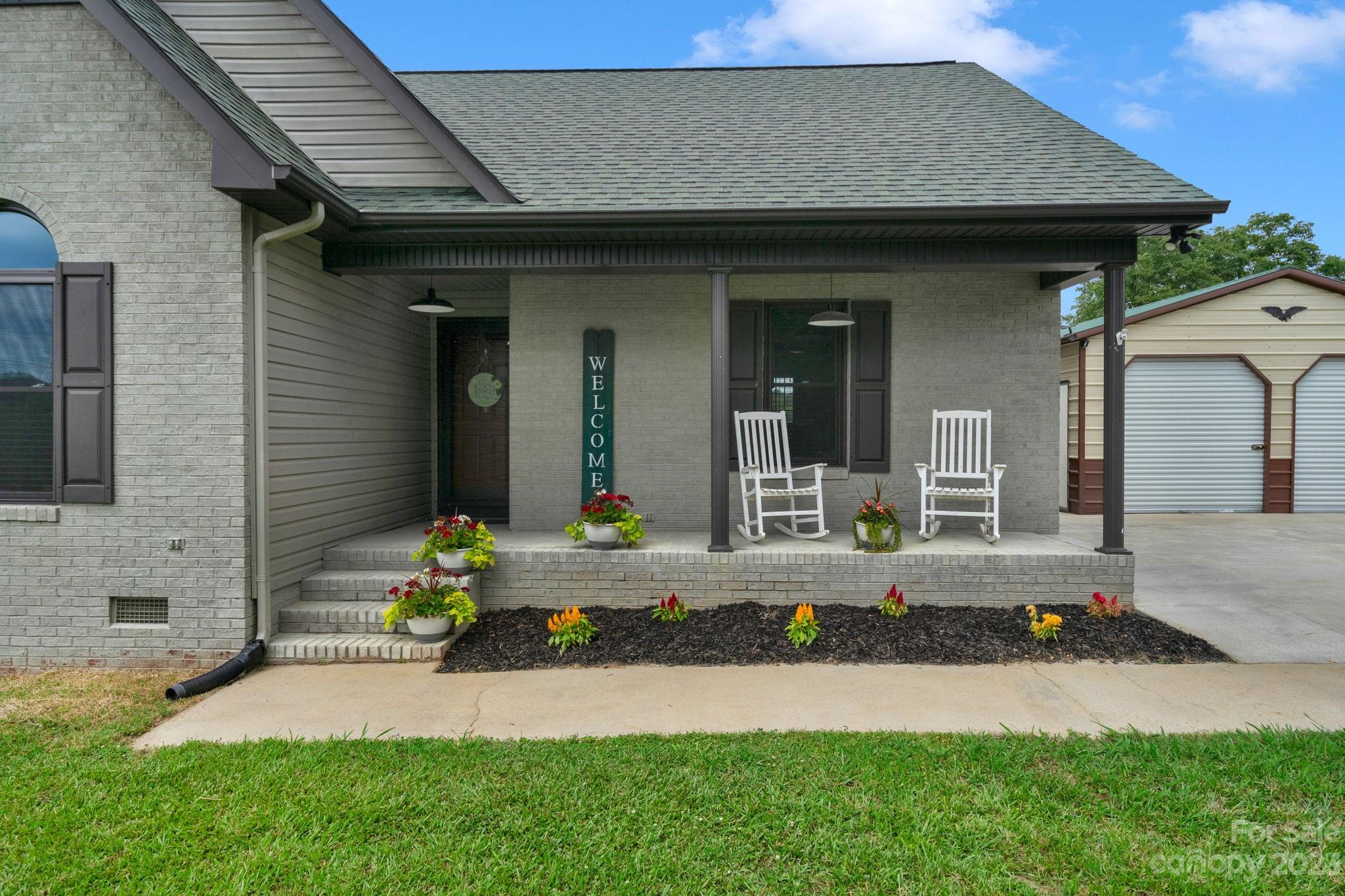 3016 Old Montgomery Place Road Monroe, NC 28112 - Photo 6 of 40 a front view of a house with garden