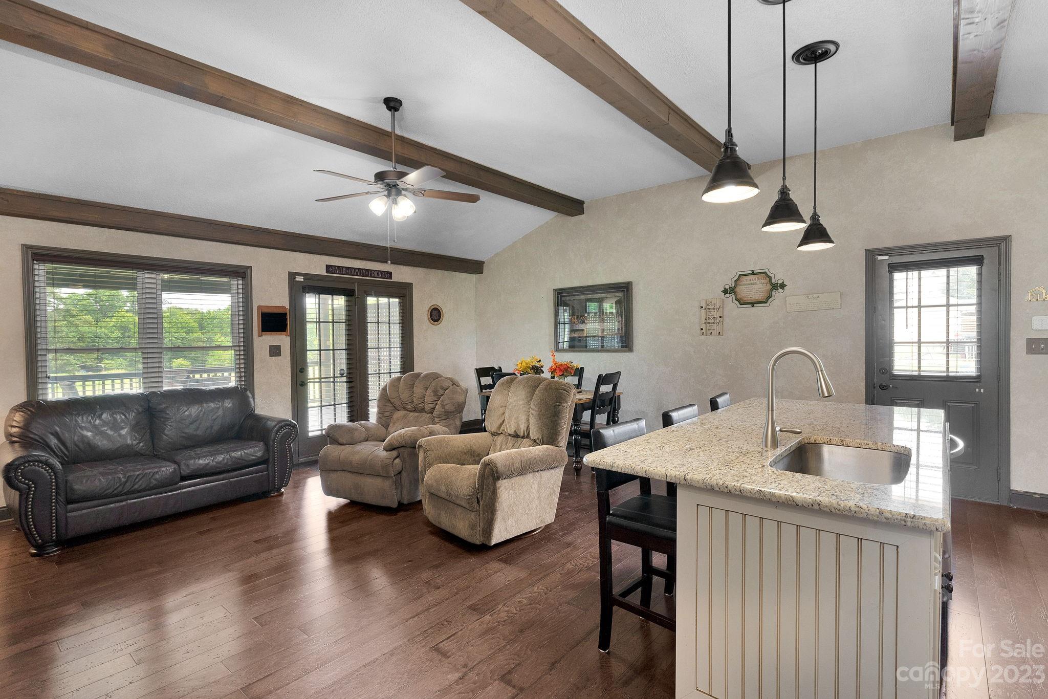 3016 Old Montgomery Place Road Monroe, NC 28112 - Photo 7 of 40 a living room with furniture flat screen tv and windows