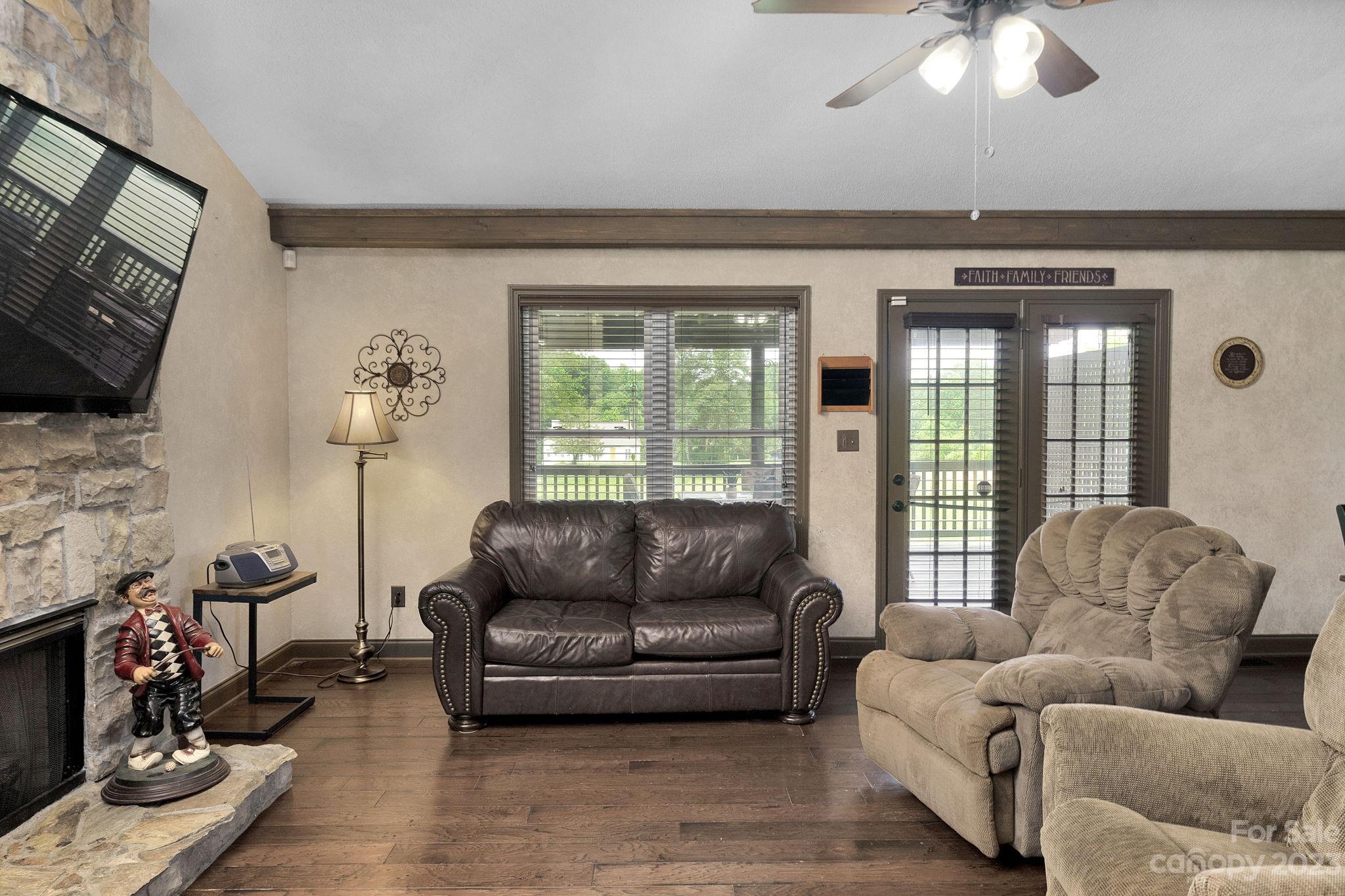 3016 Old Montgomery Place Road Monroe, NC 28112 - Photo 8 of 40 a living room with furniture and a flat screen tv
