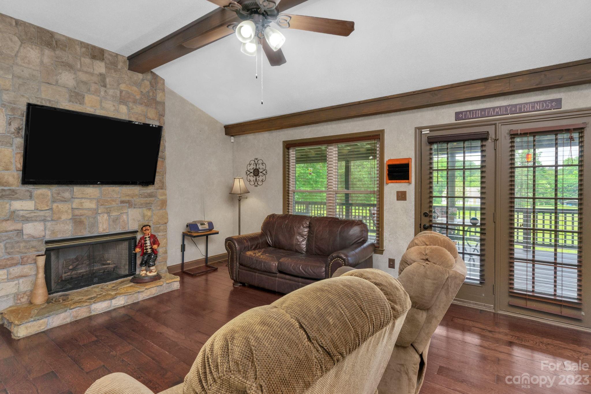 3016 Old Montgomery Place Road Monroe, NC 28112 - Photo 9 of 40 a living room with furniture fireplace and flat screen tv