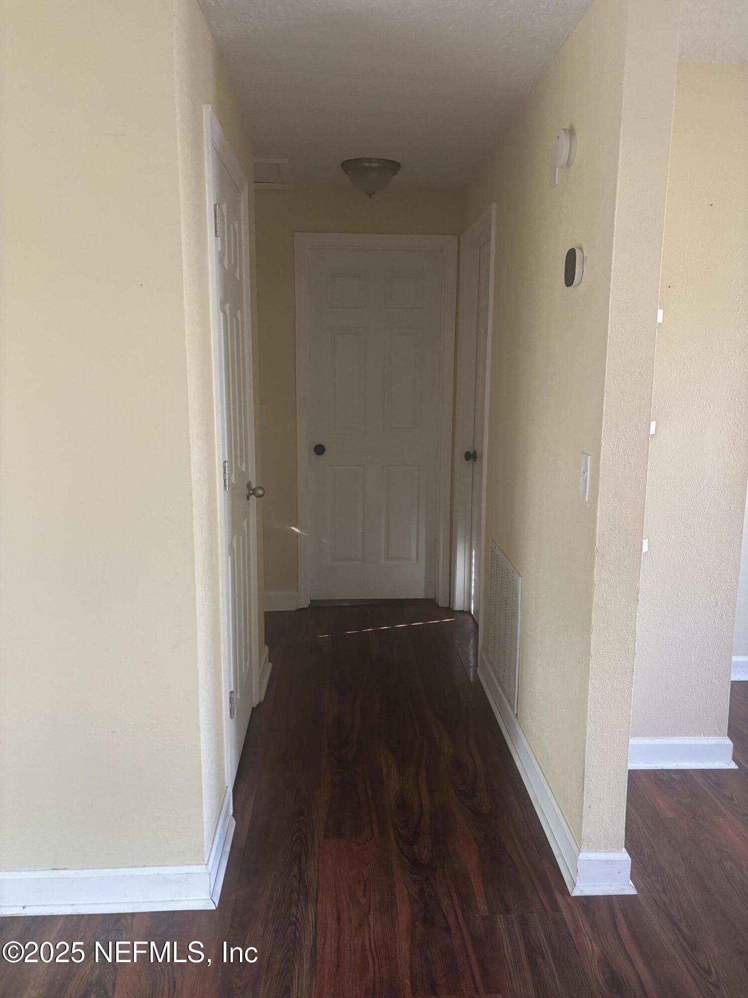 428 Neptune Road Orange Park, FL 32073 - Photo 10 of 14 a view of a hallway with wooden floor