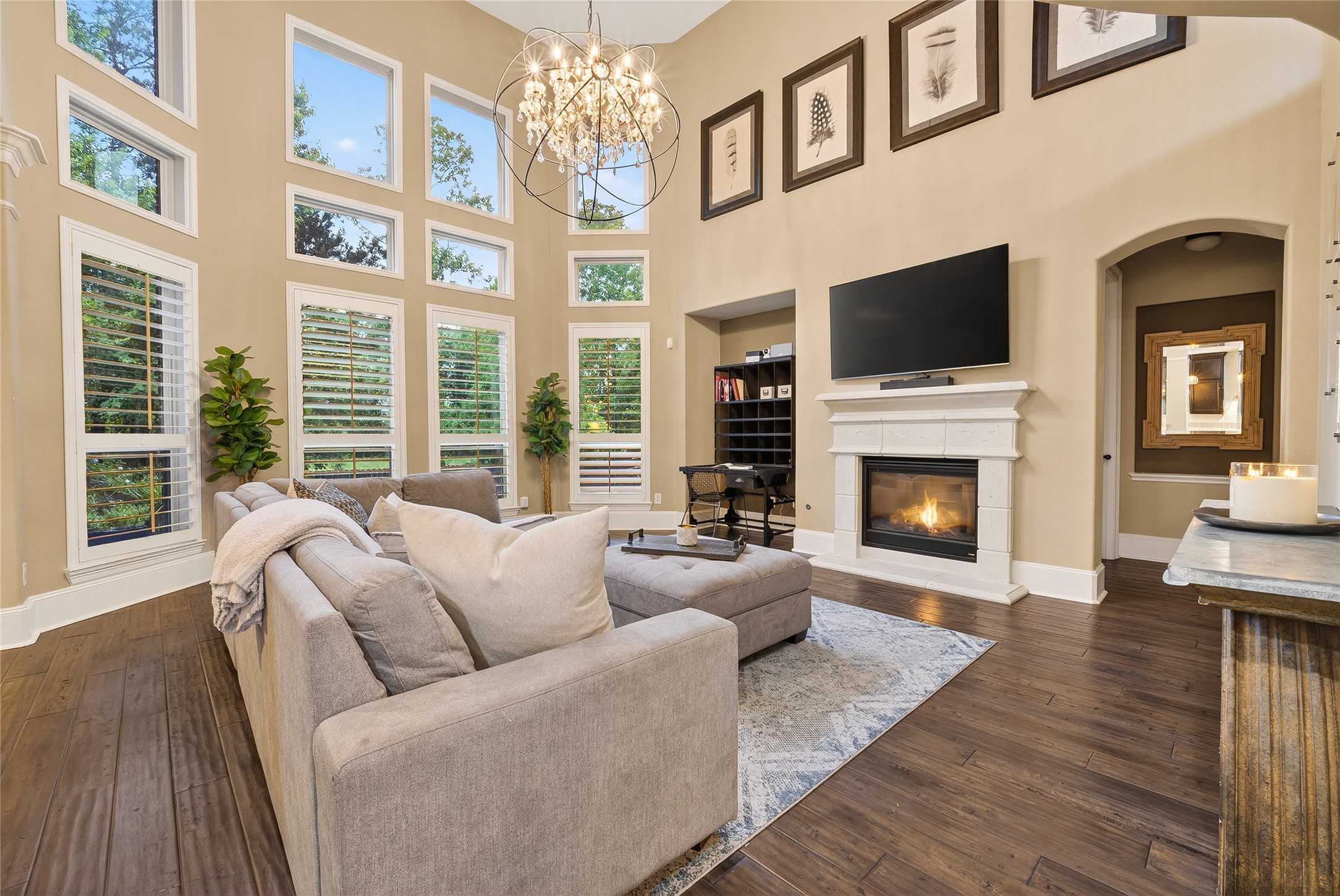 7907 Augusta Creek Court Spring, TX 77389 - Photo 22 of 49 The open layout is complemented by a stunning modern chandelier, elegant wood flooring, and a warm and stylish atmosphere.
