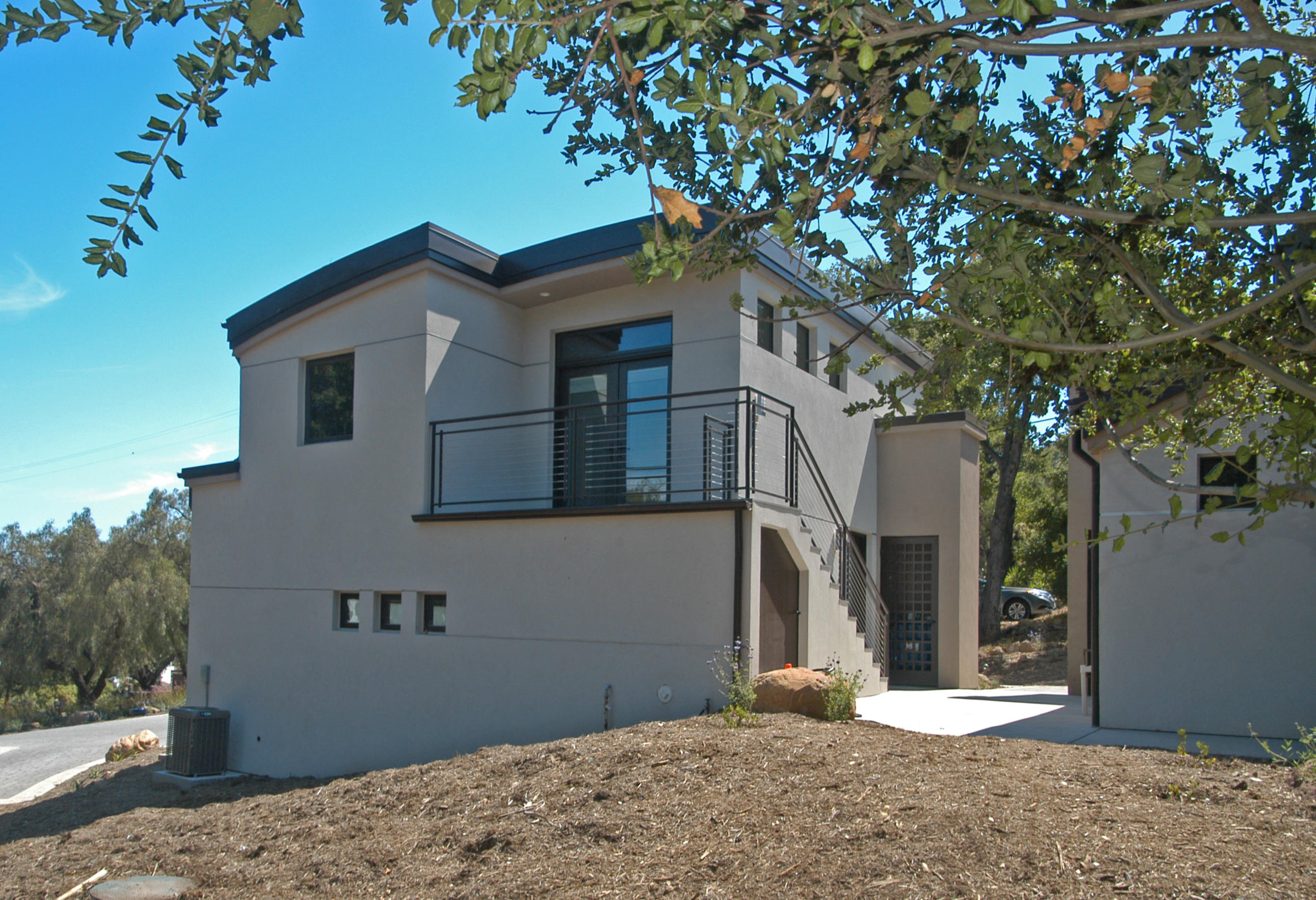 1454 Tunnel Road, Unit GUEST APARTMENT Santa Barbara, CA 93105 - Photo 1 of 10 a front view of a house with a tree
