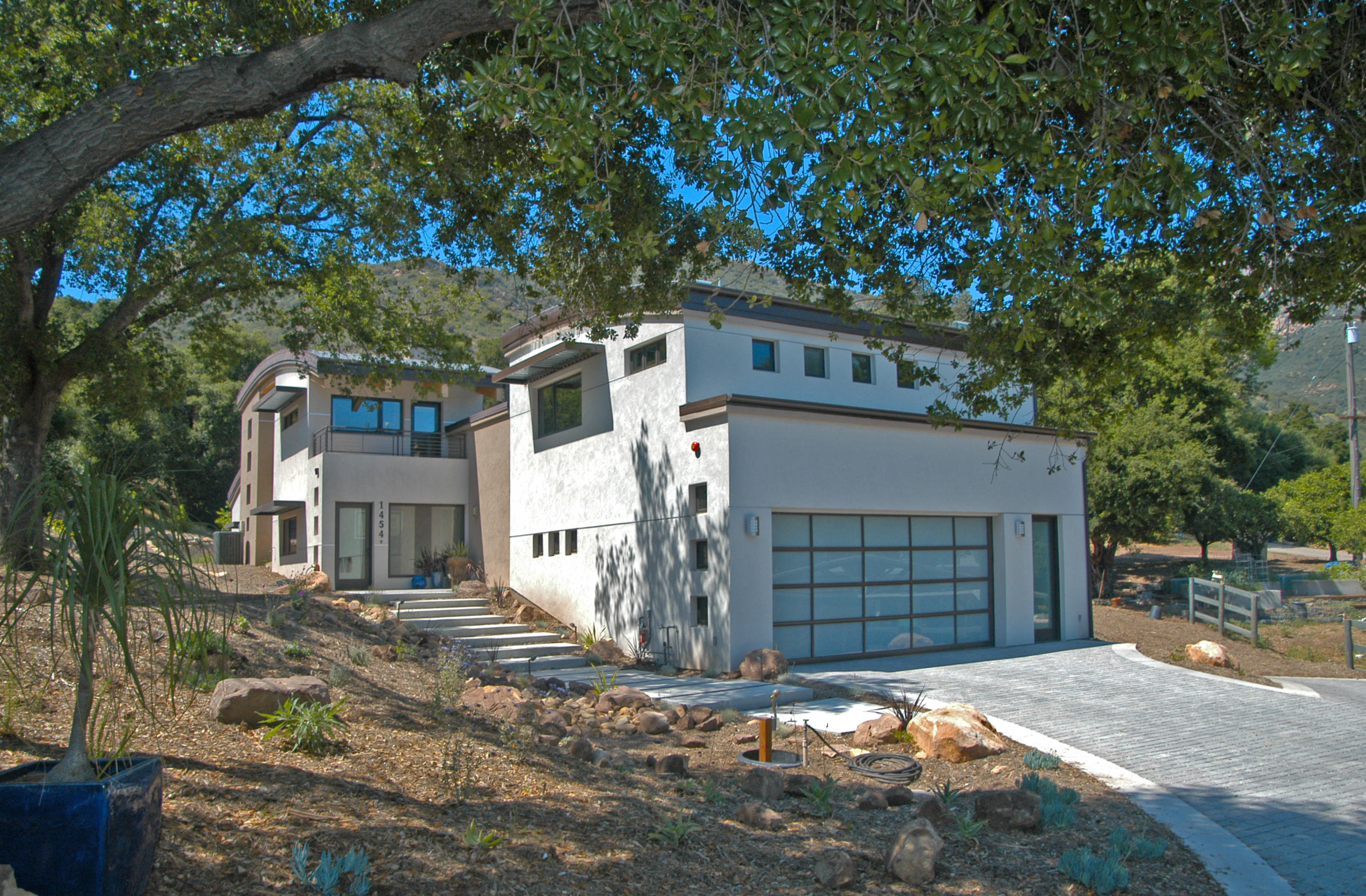 1454 Tunnel Road, Unit GUEST APARTMENT Santa Barbara, CA 93105 - Photo 10 of 10 a front view of a house with a yard and garage