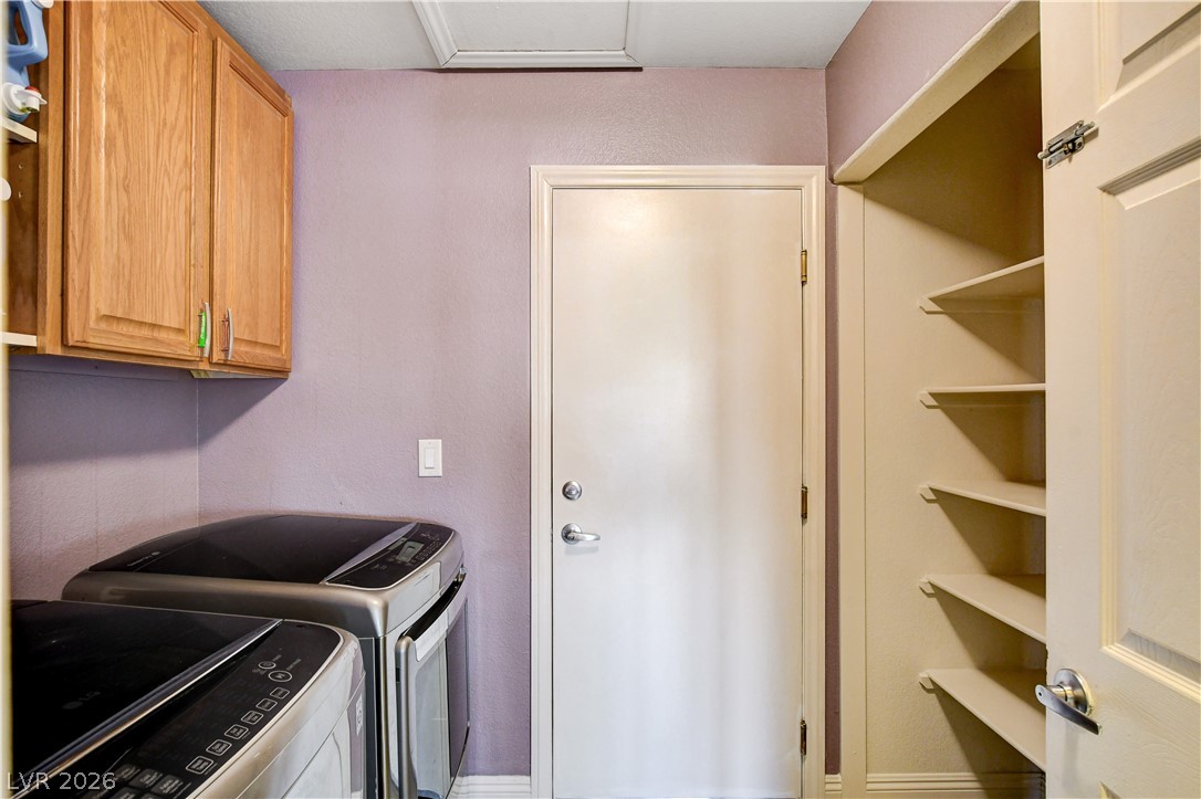 910 Cobblestone Cove Road North Las Vegas, NV 89081 - Photo 21 of 30 Functional laundry room offers convenient appliances and ample storage space.