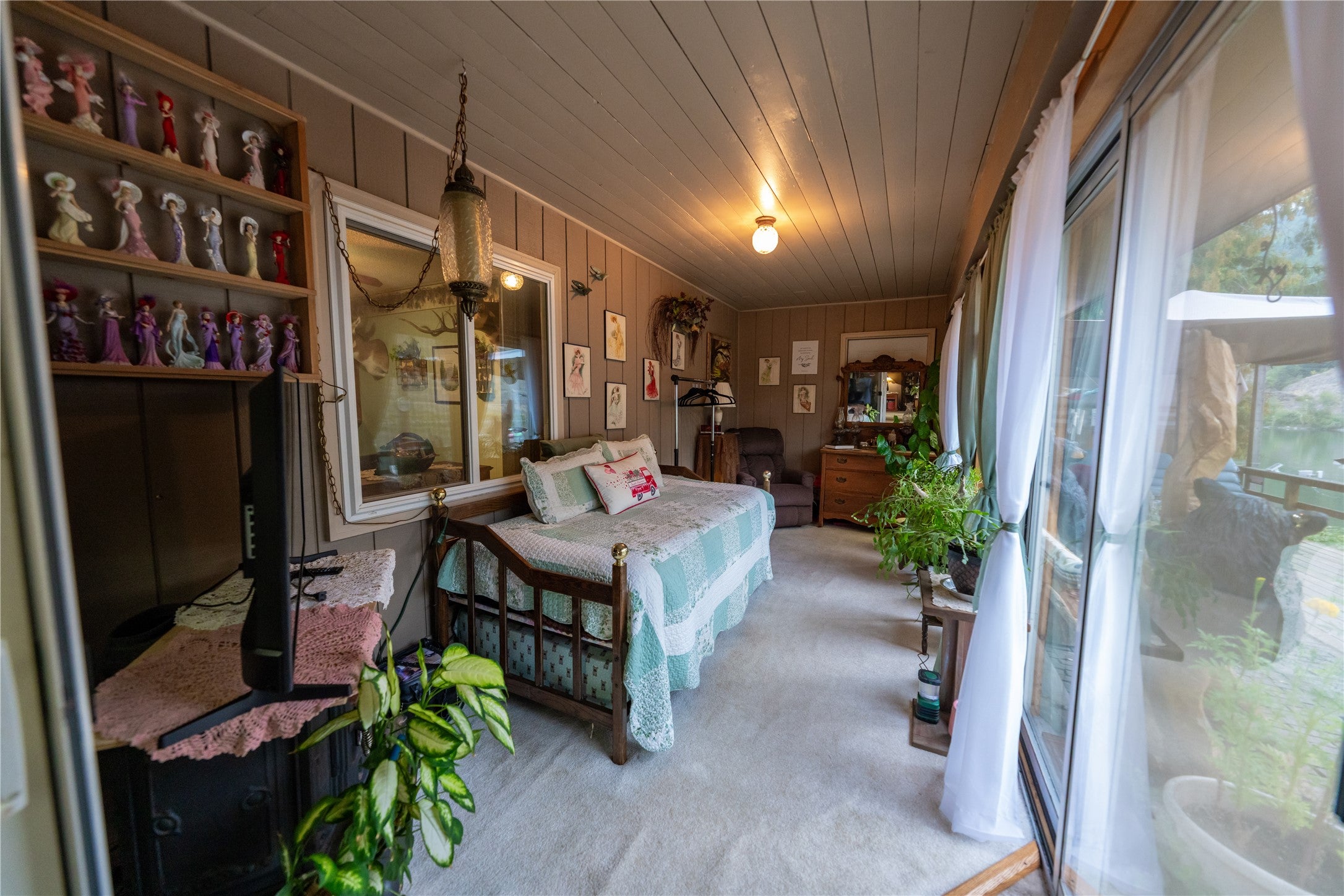 644 Waterfront Road Troy, MT 59935 - Photo 39 of 66 Sunroom/Bedroom featuring light carpet, wooden ceiling, and wooden walls