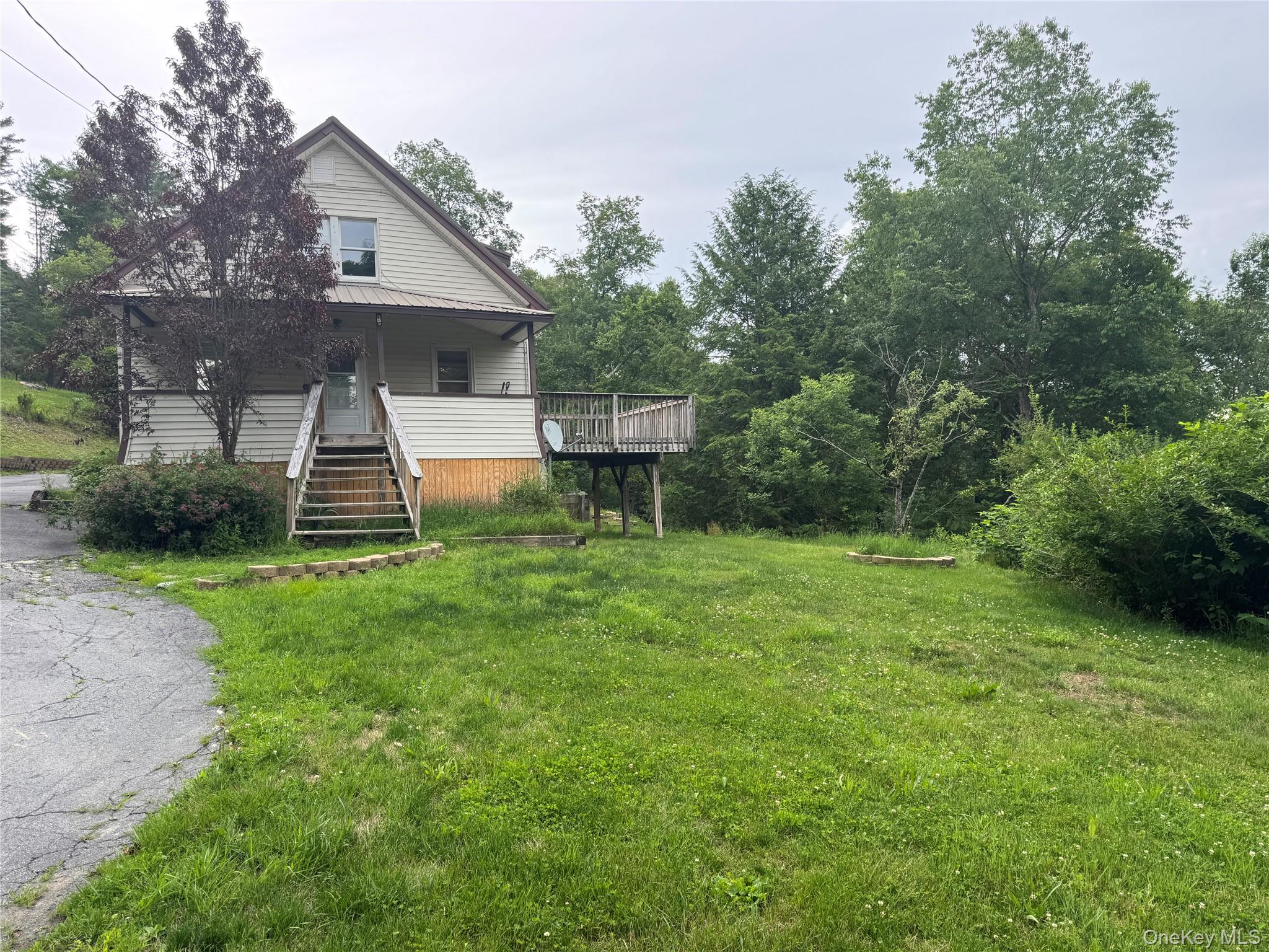 96 White Roe Lake Road Livingston Manor, NY 12758 - Photo 5 of 34 a view of a house with backyard and a tree