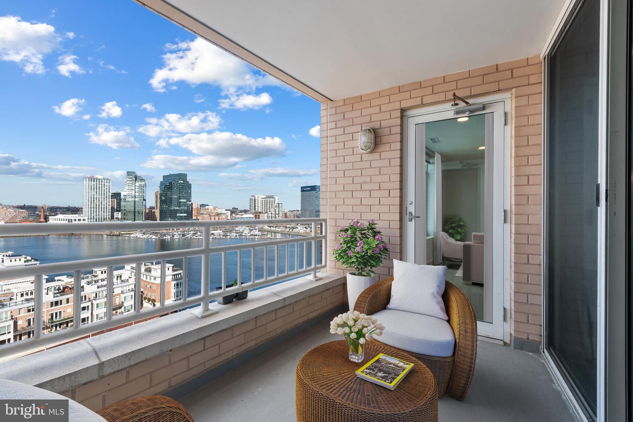 100 Harborview Drive, Unit 1209 Baltimore, MD 21230 - Photo 15 of 43 a balcony with furniture and city view