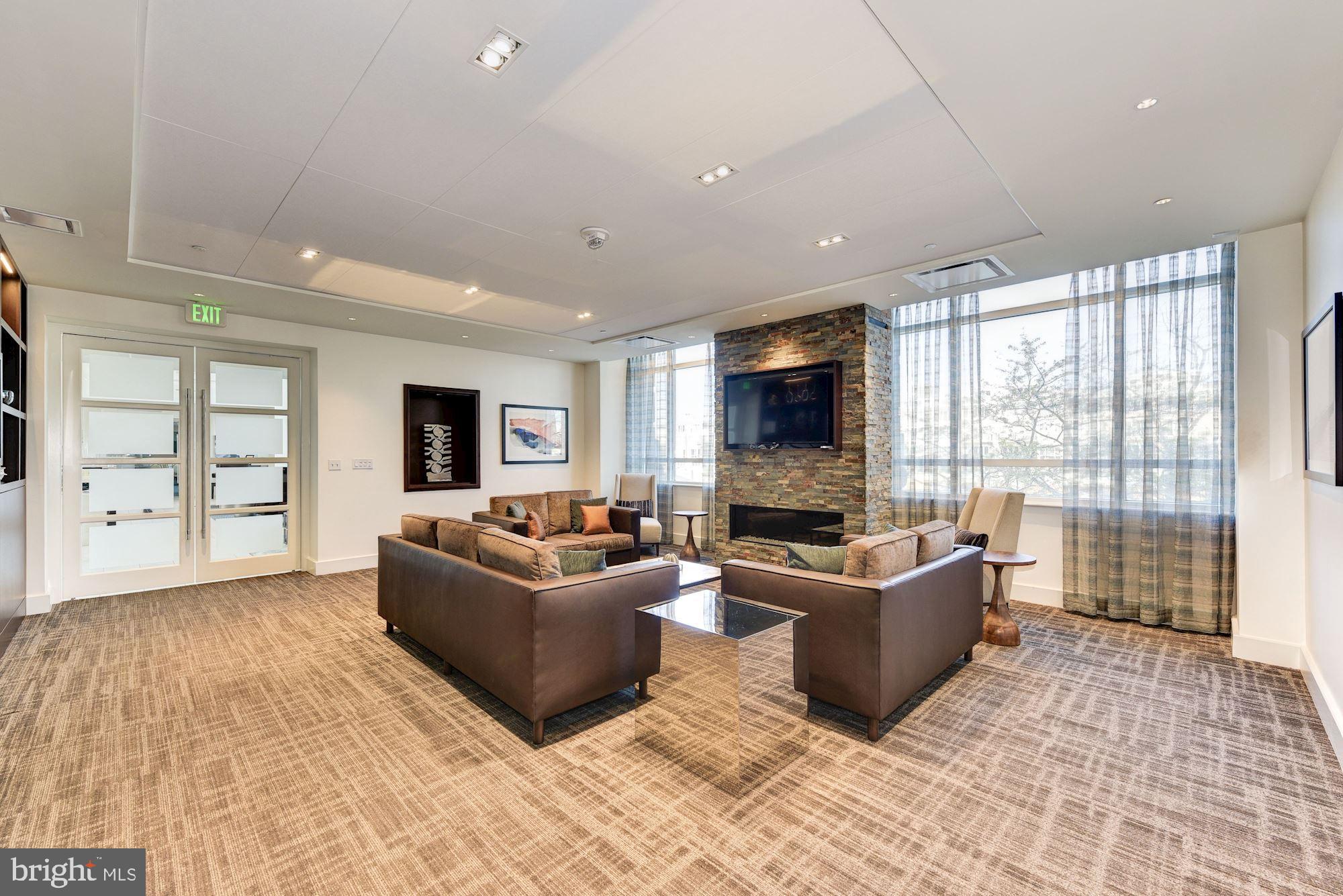 100 Harborview Drive, Unit 1209 Baltimore, MD 21230 - Photo 24 of 43 a living room with furniture and a flat screen tv