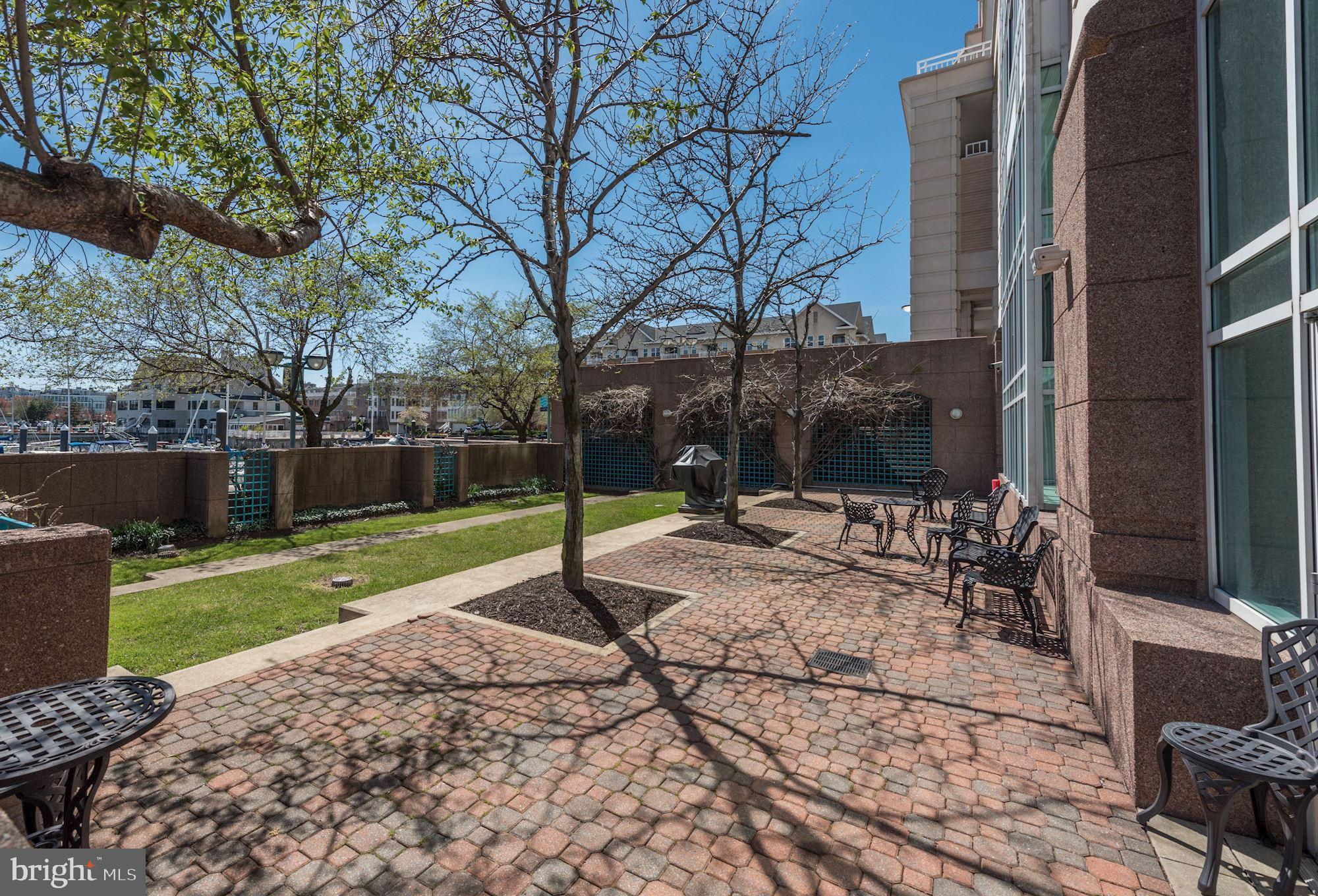 100 Harborview Drive, Unit 1209 Baltimore, MD 21230 - Photo 29 of 43 a view of a backyard with sitting area and tree s