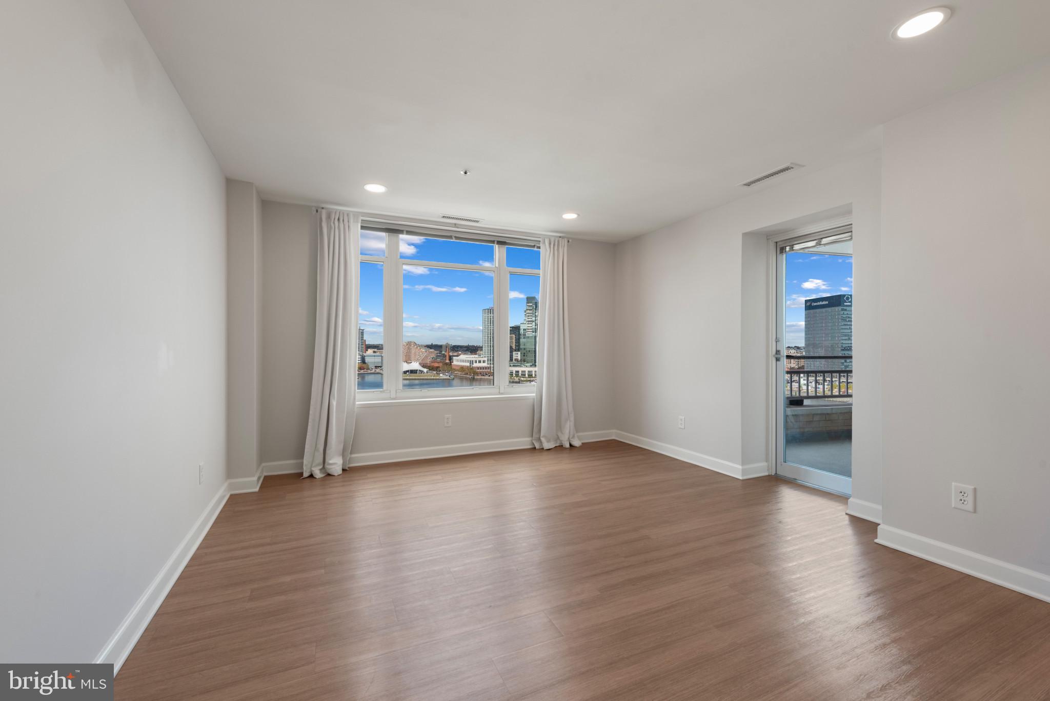 100 Harborview Drive, Unit 1209 Baltimore, MD 21230 - Photo 41 of 43 a view of a kitchen with a sink and dishwasher wooden floor