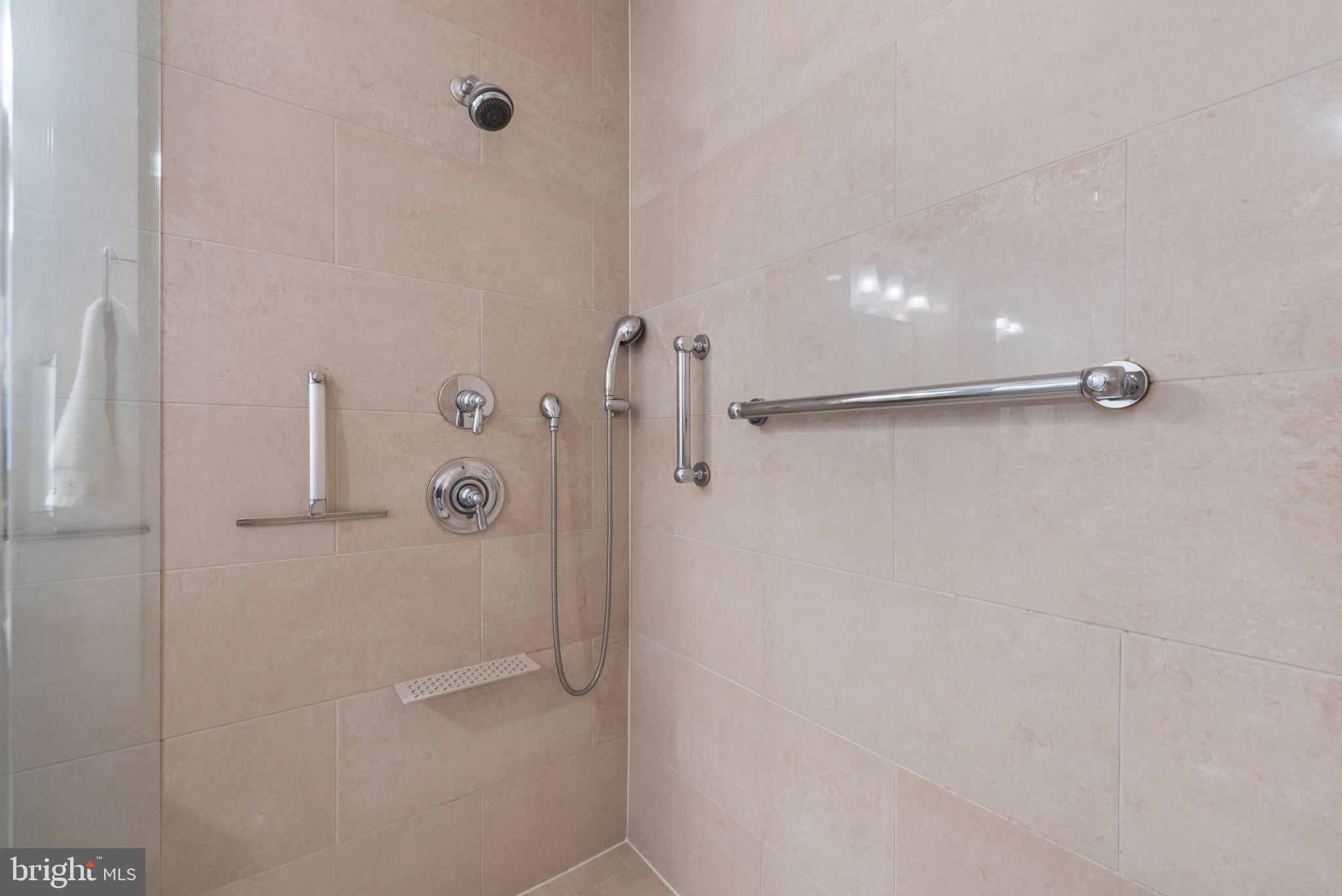 100 Harborview Drive, Unit 1209 Baltimore, MD 21230 - Photo 10 of 43 a bathroom with a shower