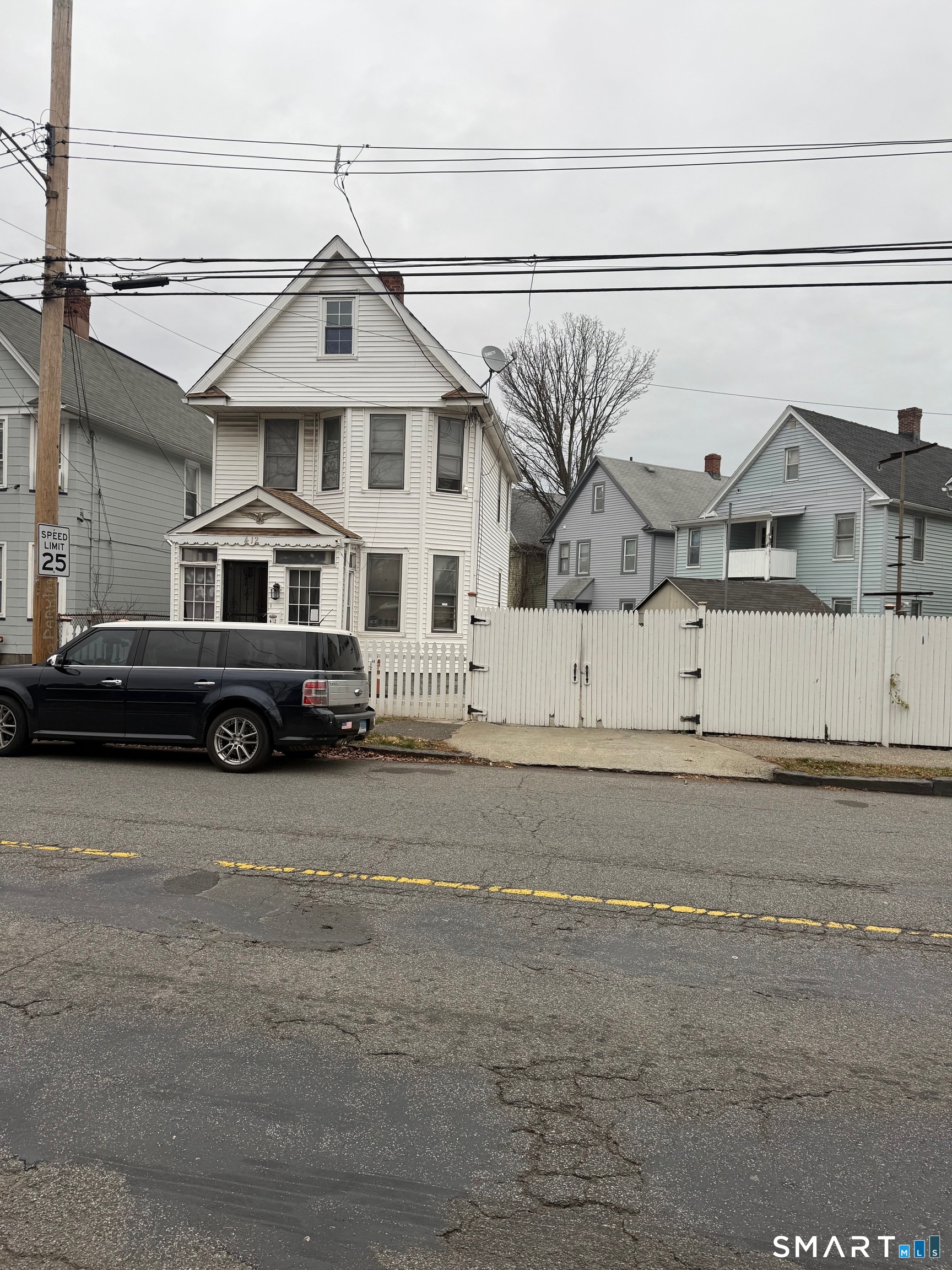 412 Dewey Street Bridgeport, CT 06605 - Photo 2 of 10 a front view of a house with a yard