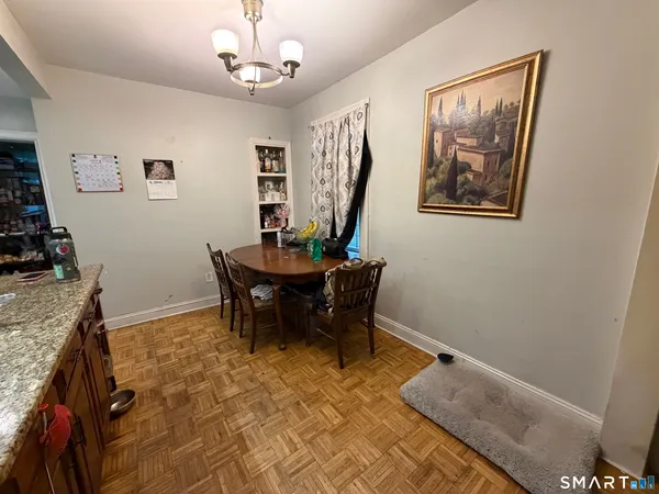 a view of a livingroom with furniture and a chandelier