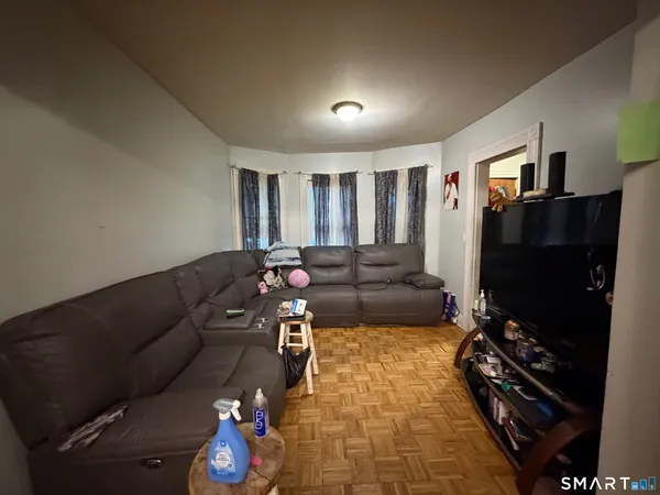a living room with furniture and a flat screen tv