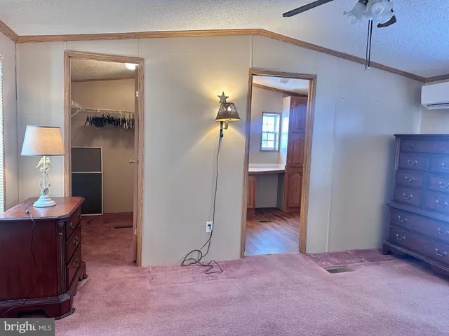 a view of a room with closet and mirror
