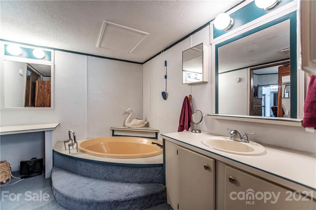 1481 Old Friendship Road Rock Hill, SC 29730 - Photo 15 of 23 a bathroom with a tub sink and mirror