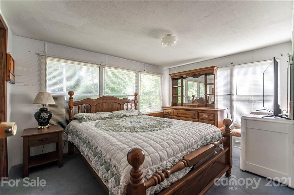 1481 Old Friendship Road Rock Hill, SC 29730 - Photo 18 of 23 a bedroom with a bed and large windows
