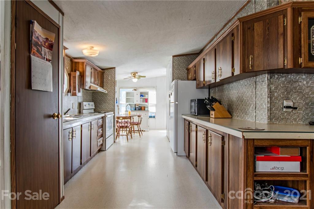 1481 Old Friendship Road Rock Hill, SC 29730 - Photo 7 of 23 a kitchen with stainless steel appliances granite countertop a refrigerator a stove top oven a sink and dishwasher