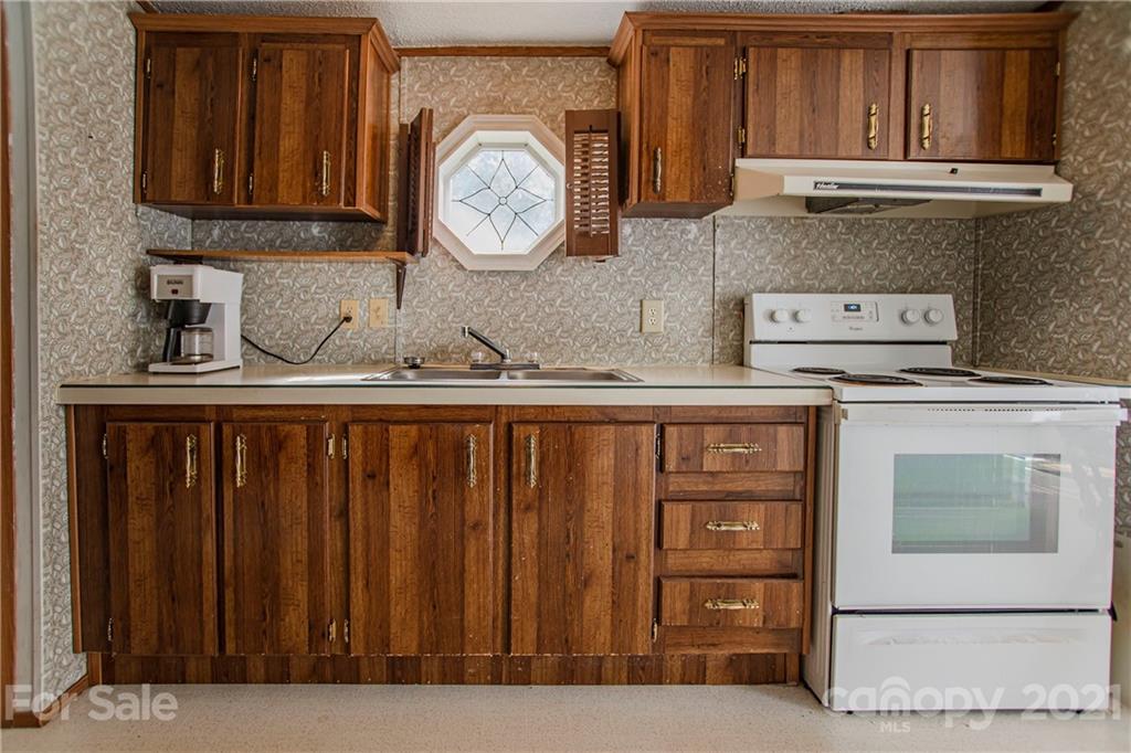 1481 Old Friendship Road Rock Hill, SC 29730 - Photo 8 of 23 a kitchen with stainless steel appliances granite countertop a stove a cabinets and a sink