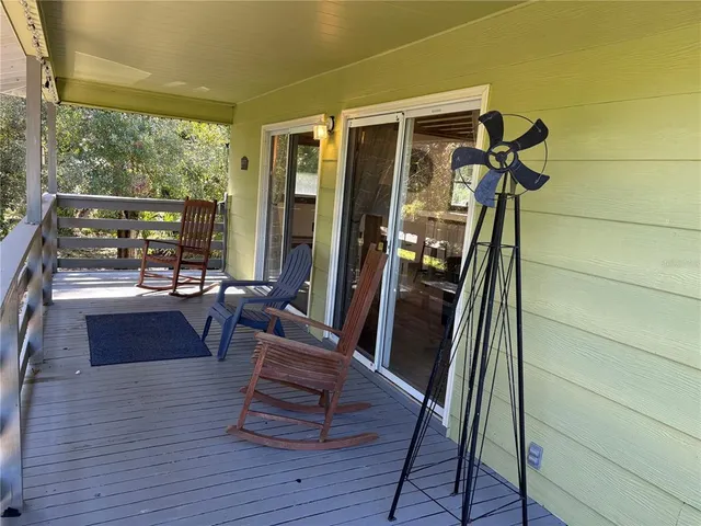 a view of living room with furniture and wooden floor