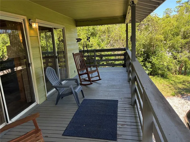 a view of two chairs in the balcony