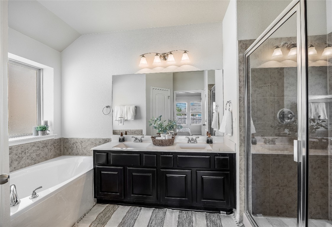 5836 Novaro Place Round Rock, TX 78665 - Photo 18 of 36 Tub and shower in primary bathroom