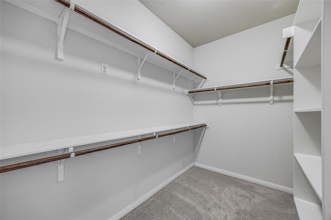 5836 Novaro Place Round Rock, TX 78665 - Photo 22 of 36 Large walk in closet in primary bedroom.