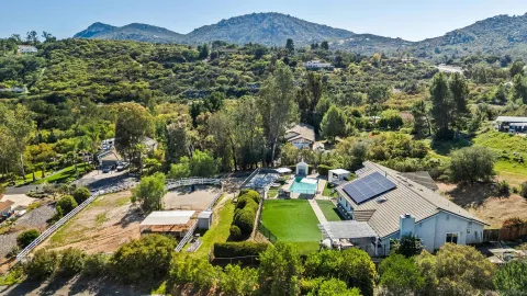 an aerial view of a house with a garden