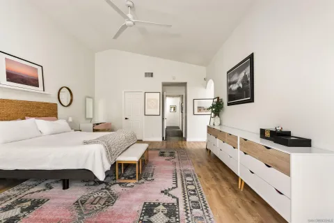 a bed room with a bed couch and a window